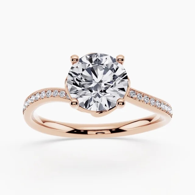 Curved engagement ring with a contoured band and center diamond