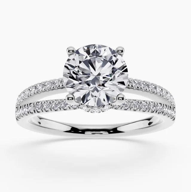 Hidden halo engagement ring with diamonds under the center stone