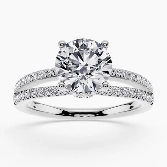 Hidden halo engagement ring with diamonds under the center stone