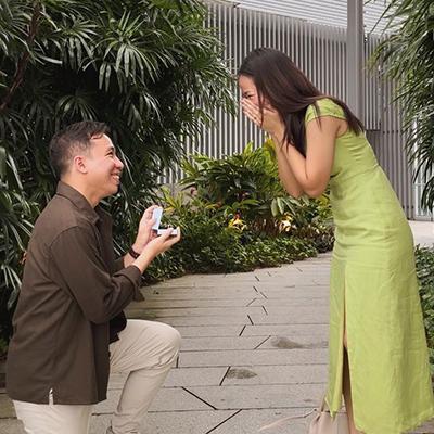 Romantic proposal with diamond ring in the park