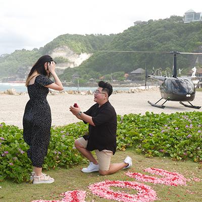 Beach proposal with diamond ring