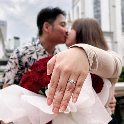 Romantic proposal with diamond ring on the beach